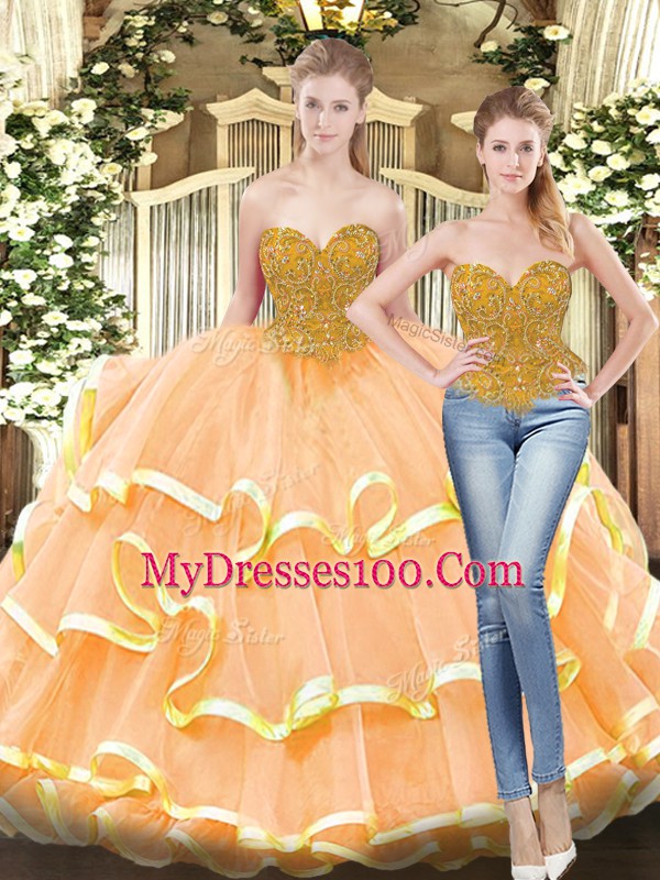 Sweetheart Sleeveless Quinceanera Gowns Floor Length Beading and Ruffled Layers Peach Tulle