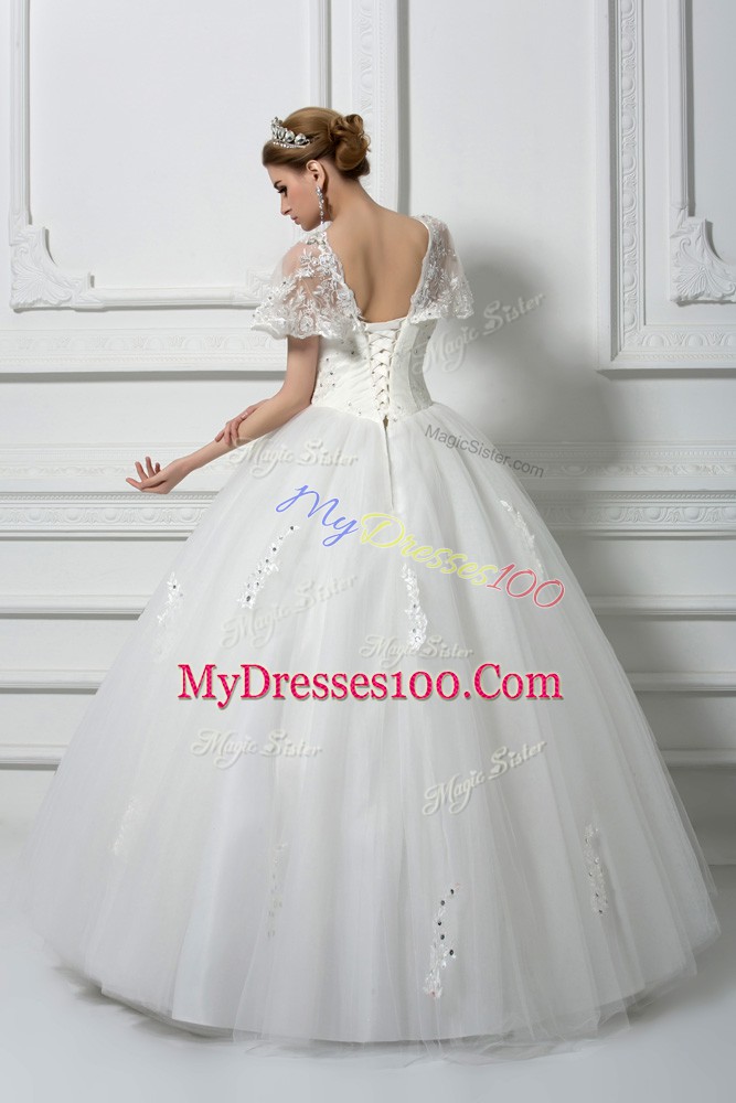 Fitting Tulle Short Sleeves Floor Length Wedding Gowns and Beading and Appliques