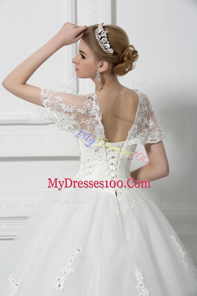 Fitting Tulle Short Sleeves Floor Length Wedding Gowns and Beading and Appliques
