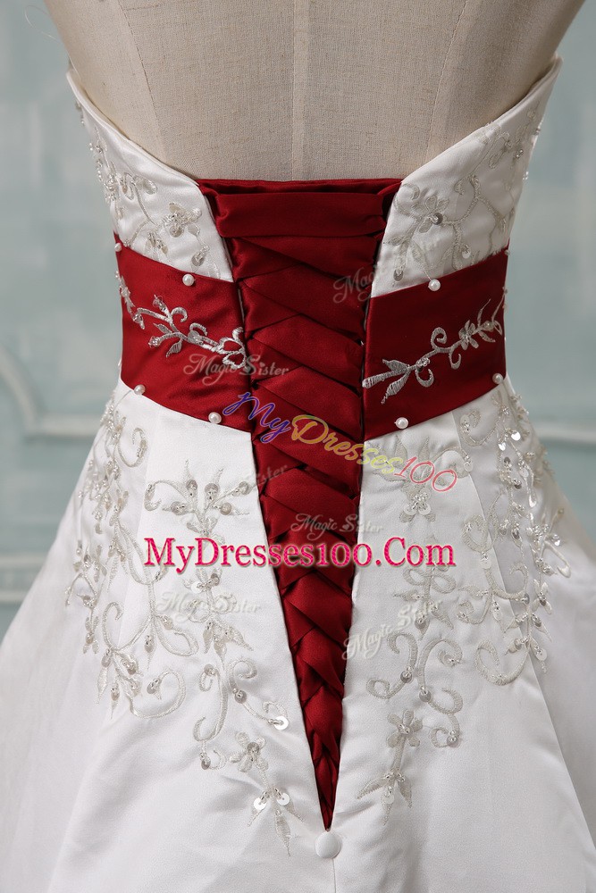 Dramatic White Halter Top Neckline Beading and Embroidery Wedding Gowns Sleeveless Lace Up