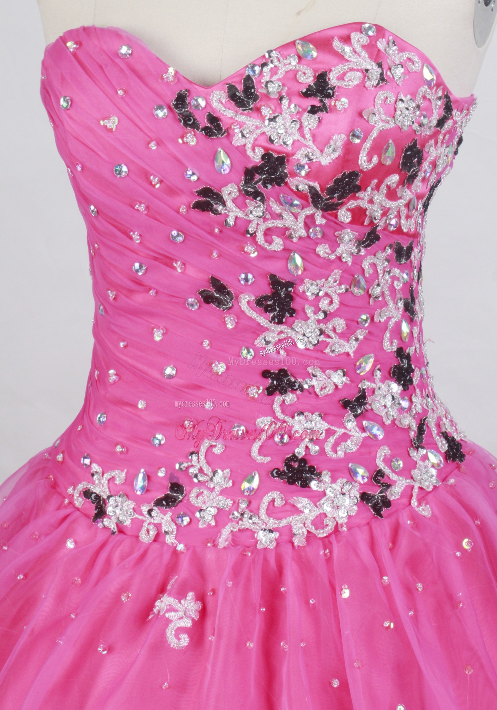 Black and White Appliques Decorate Quinceanera Gown in Hot Pink