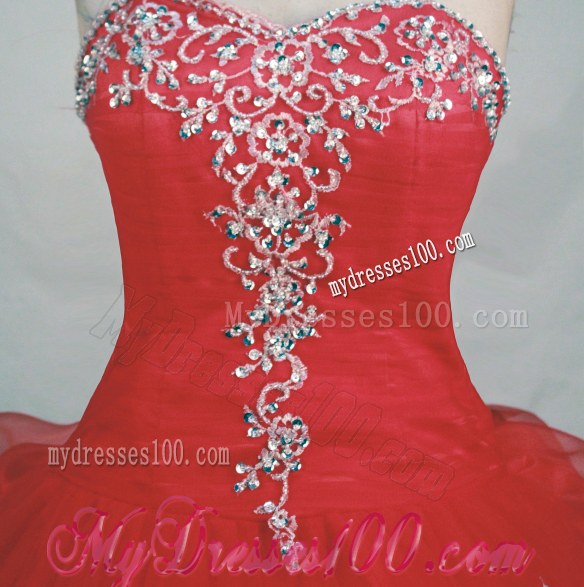 Sweetheart Pick-Ups and Rhinestones Decorate Quinceanera Dresses in Red