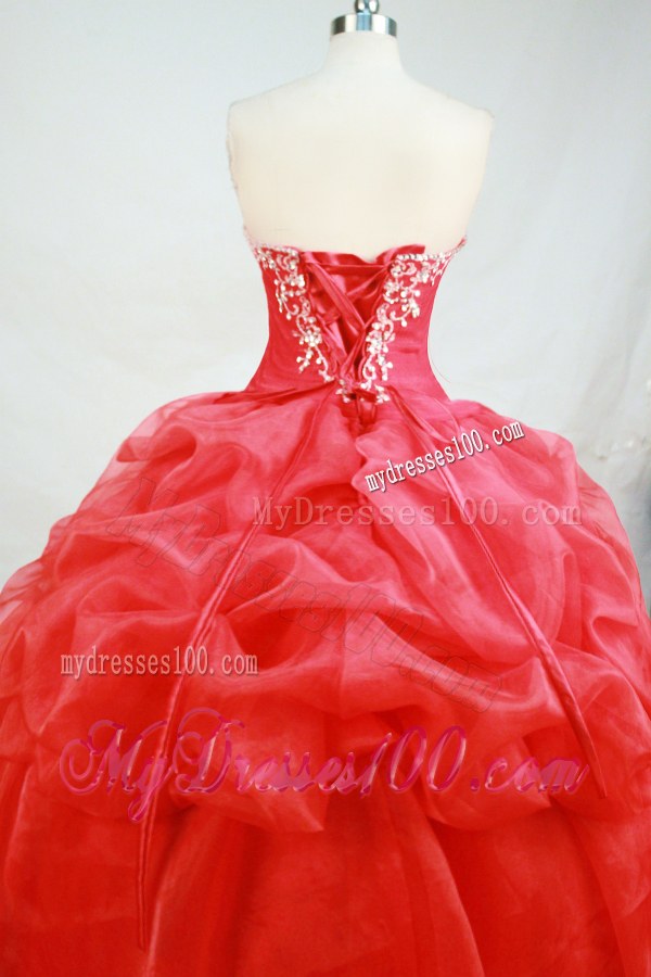 Sweetheart Pick-Ups and Rhinestones Decorate Quinceanera Dresses in Red