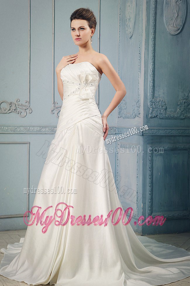 Beaded Appliques and Ruches Accent Chapel Train Bridal Gown with Bow