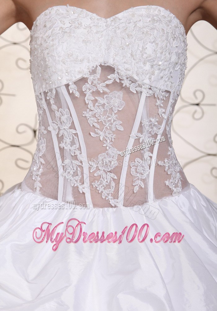 Pick-ups and Appliques Accent Bridal Gown with Sheer Waist Chapel