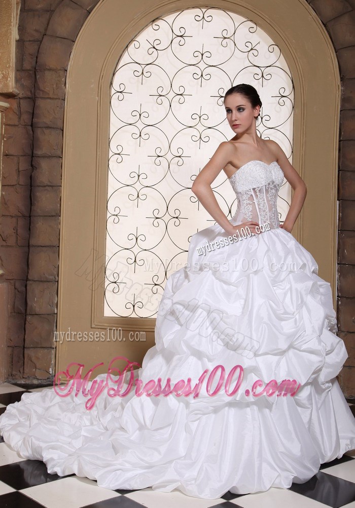 Pick-ups and Appliques Accent Bridal Gown with Sheer Waist Chapel