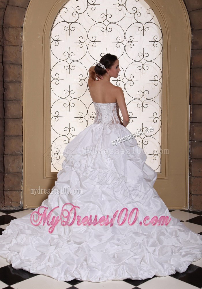 Pick-ups and Appliques Accent Bridal Gown with Sheer Waist Chapel