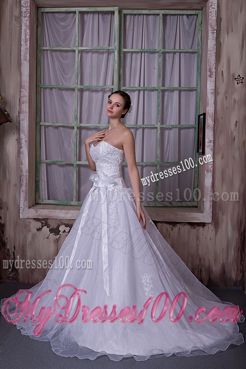Appliques and Sash Accent on Chapel Train Sleeveless Wedding Gown