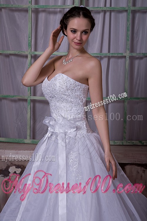 Appliques and Sash Accent on Chapel Train Sleeveless Wedding Gown