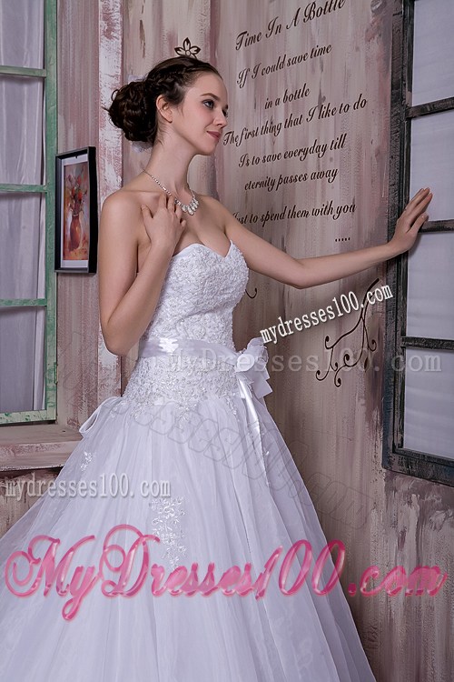 Appliques and Sash Accent on Chapel Train Sleeveless Wedding Gown