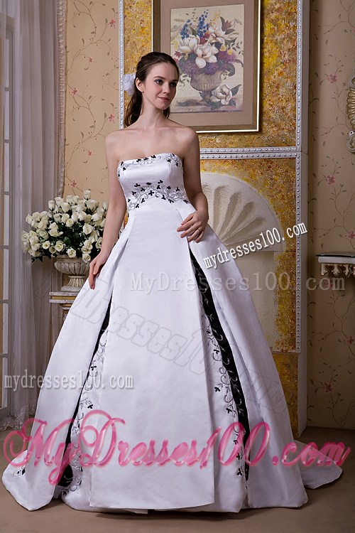 White Puffy Court Train Dress for Wedding Decorated with Black Embroideries