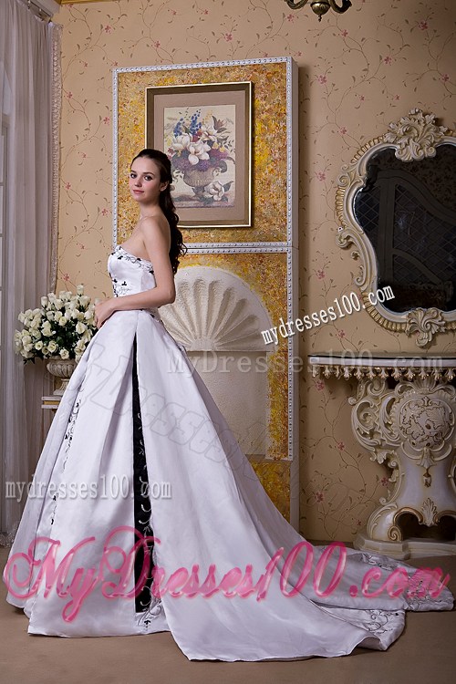 White Puffy Court Train Dress for Wedding Decorated with Black Embroideries