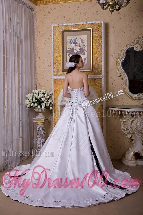 White Puffy Court Train Dress for Wedding Decorated with Black Embroideries