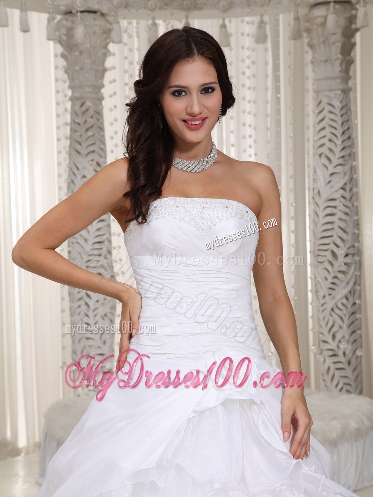Flowers and Ruffled Layers Floor-length Strapless Beaded Bridal Gown
