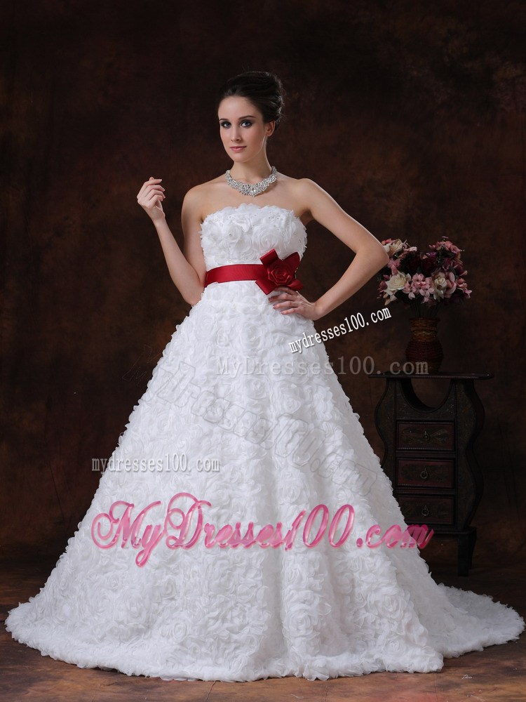 Brush Train Wedding Gown with Rolling Flowers over Skirt and Red Belt