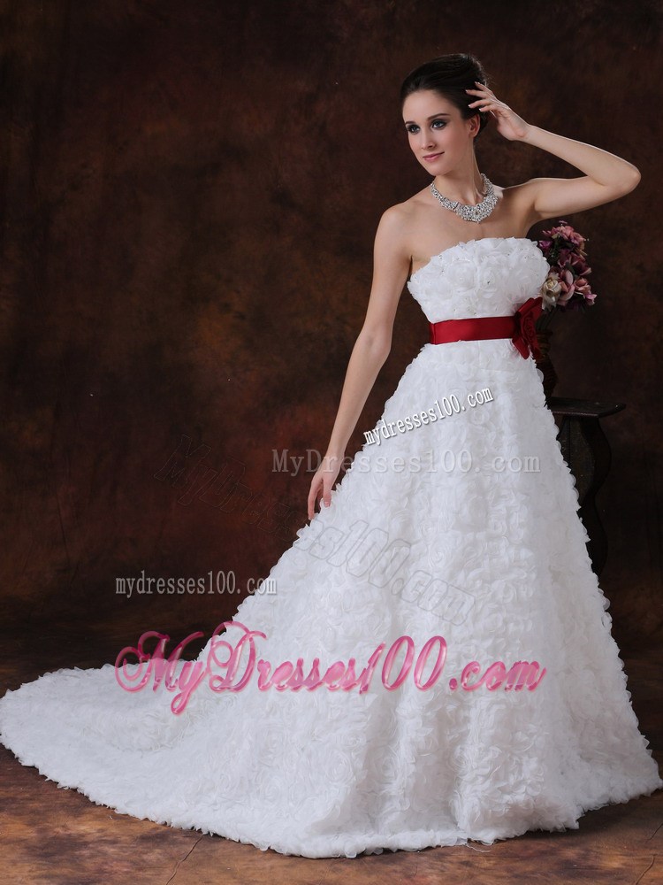 Brush Train Wedding Gown with Rolling Flowers over Skirt and Red Belt