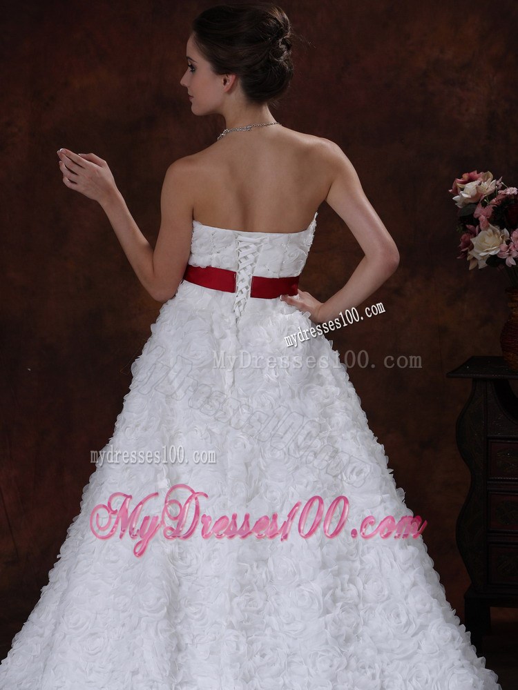 Brush Train Wedding Gown with Rolling Flowers over Skirt and Red Belt