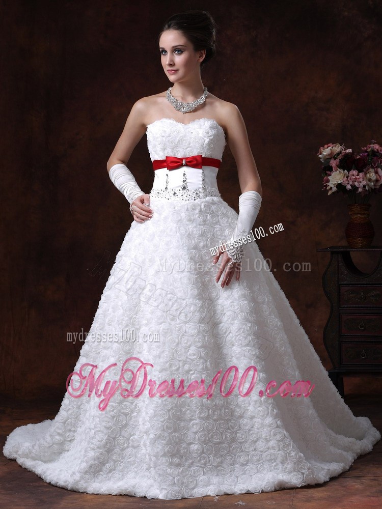 Lace-up Brush Wedding Gown with Rolling Flowers and Red Bowknot Sash