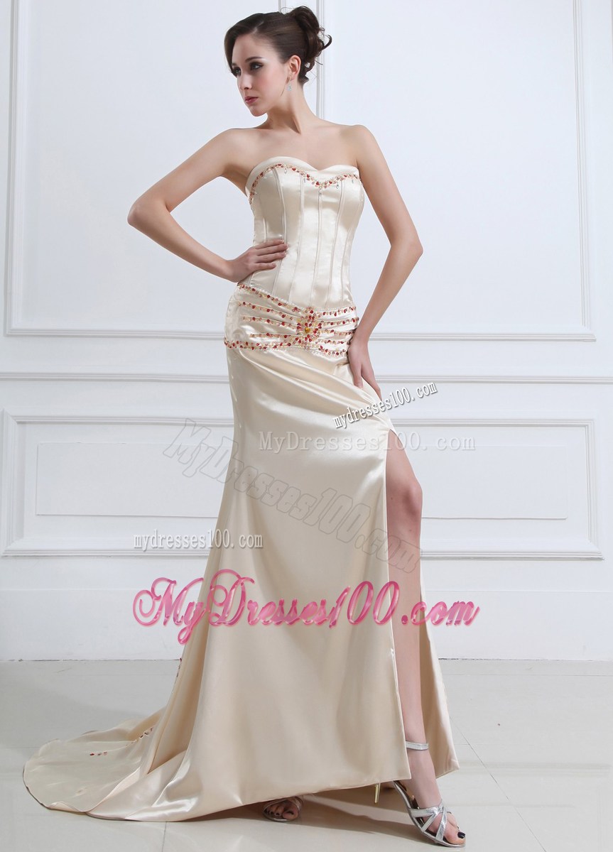Elegant Brush Train Champagne Prom Dress with Red Beading and High Slit