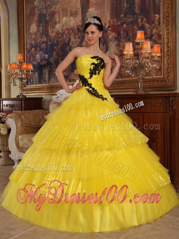 Shining Yellow Quinceanera Dress with Layers and Black Appliques