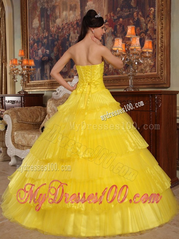 Shining Yellow Quinceanera Dress with Layers and Black Appliques