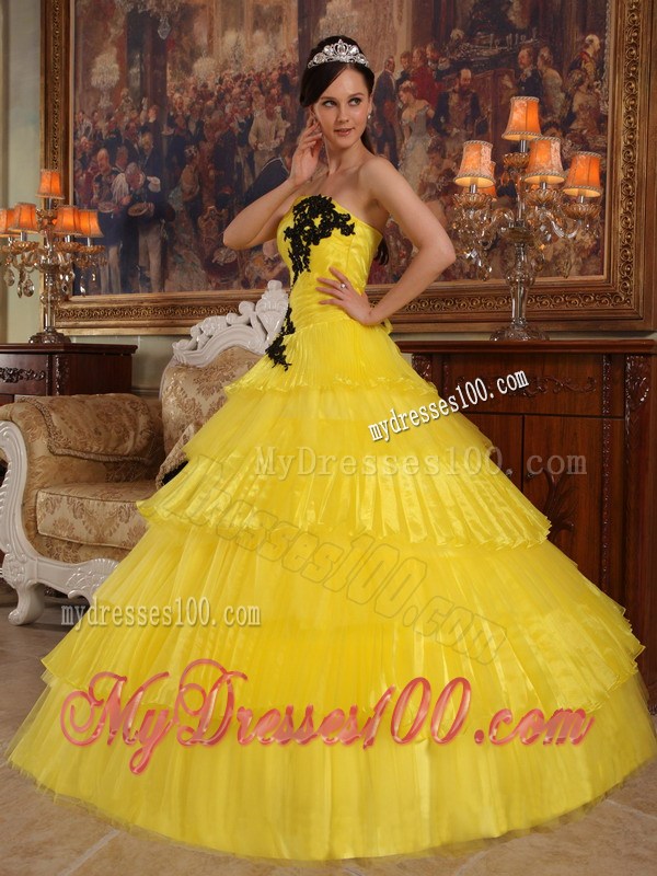 Shining Yellow Quinceanera Dress with Layers and Black Appliques