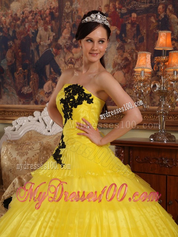 Shining Yellow Quinceanera Dress with Layers and Black Appliques