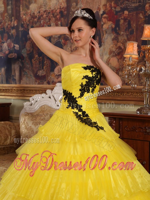Shining Yellow Quinceanera Dress with Layers and Black Appliques