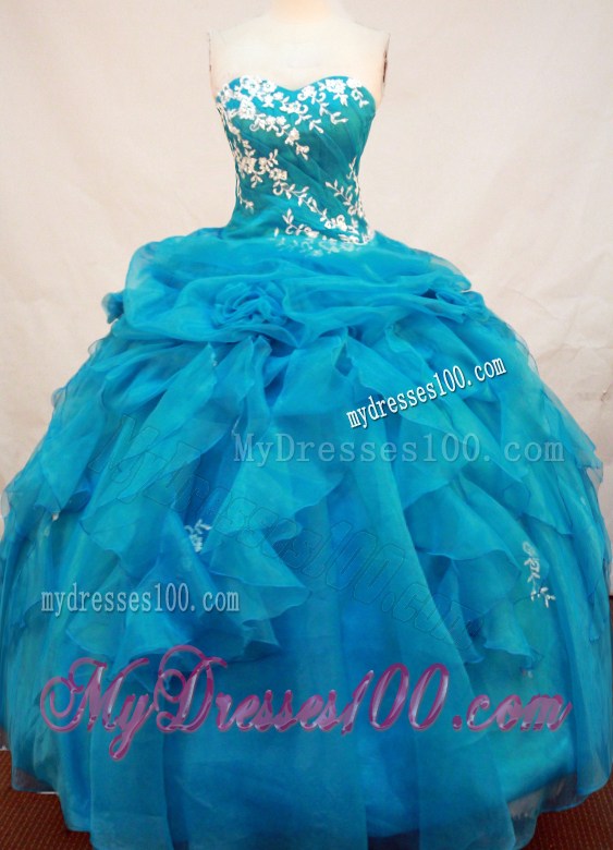 Puffy Sweetheart Appliques and Rhinestones Decorate Ruffled Sweet 16 Dress