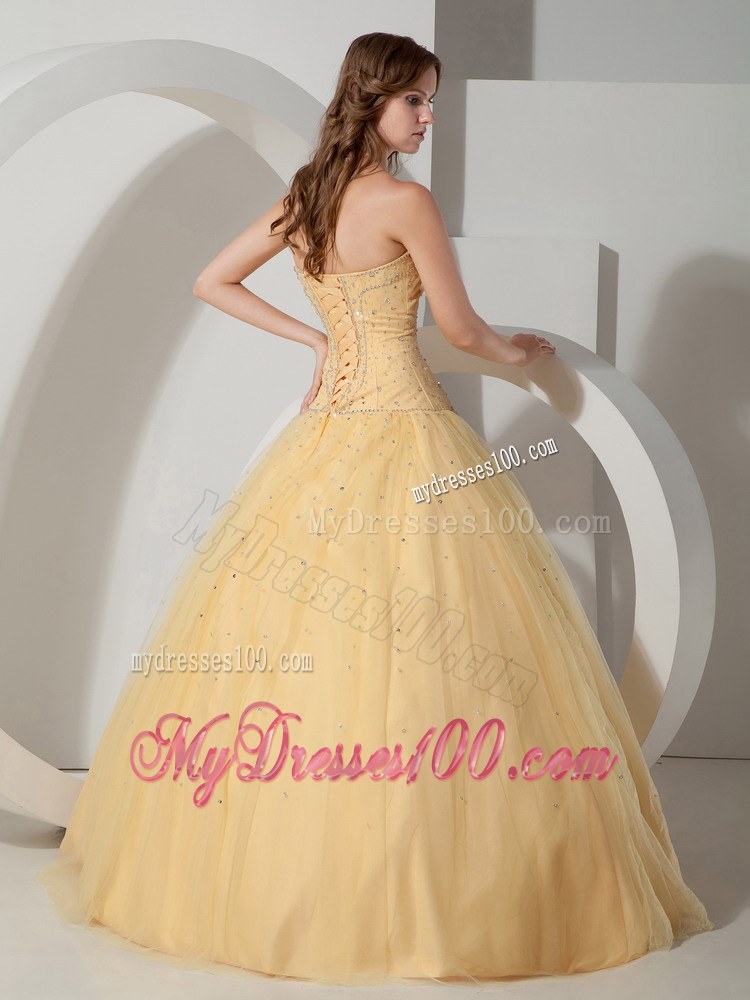 Light Yellow Strapless Beaded Quinceanera Dress with Lace-up
