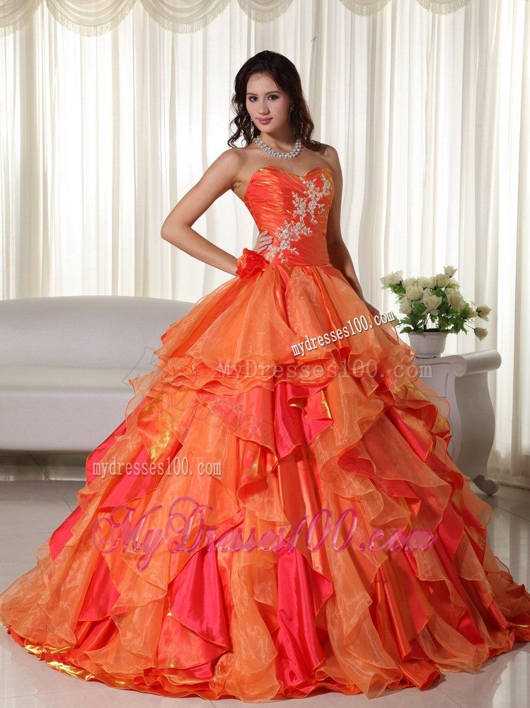 Ruched Orange Quinceanera Gown with Appliques and Ruffled Layers