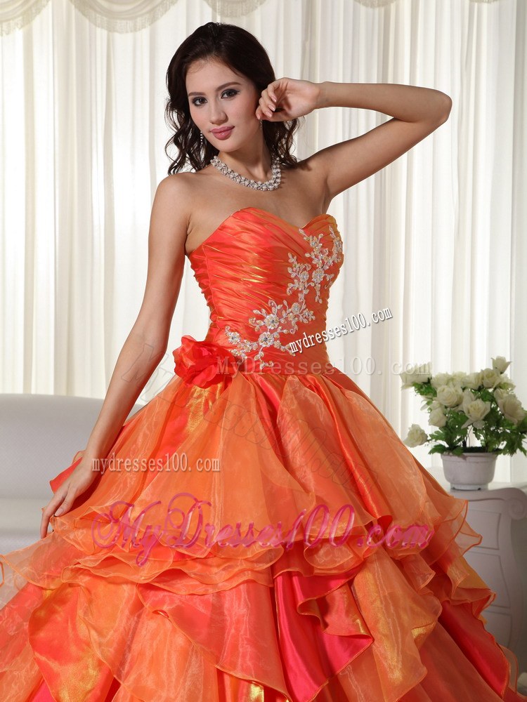 Ruched Orange Quinceanera Gown with Appliques and Ruffled Layers