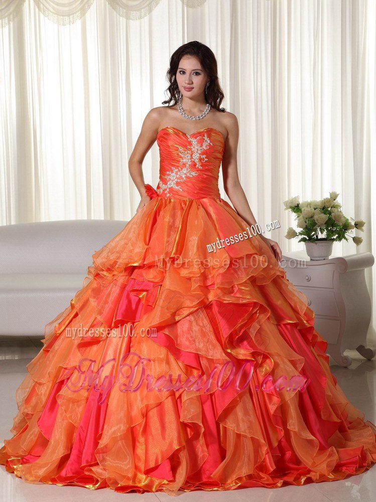 Ruched Orange Quinceanera Gown with Appliques and Ruffled Layers