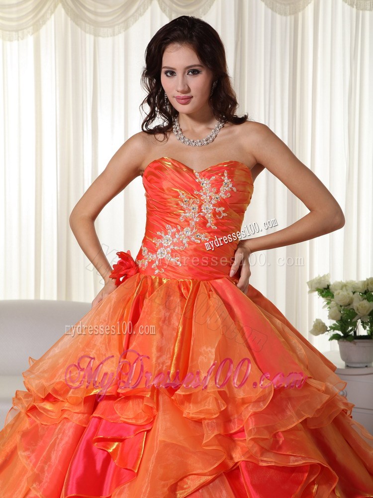 Ruched Orange Quinceanera Gown with Appliques and Ruffled Layers