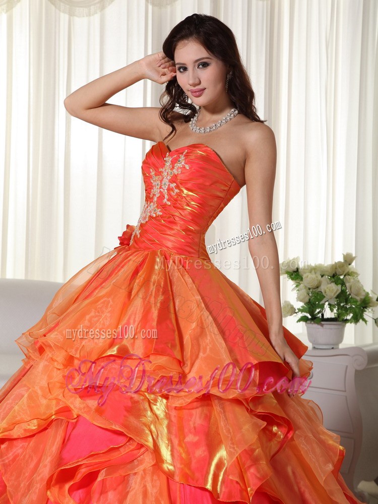Ruched Orange Quinceanera Gown with Appliques and Ruffled Layers