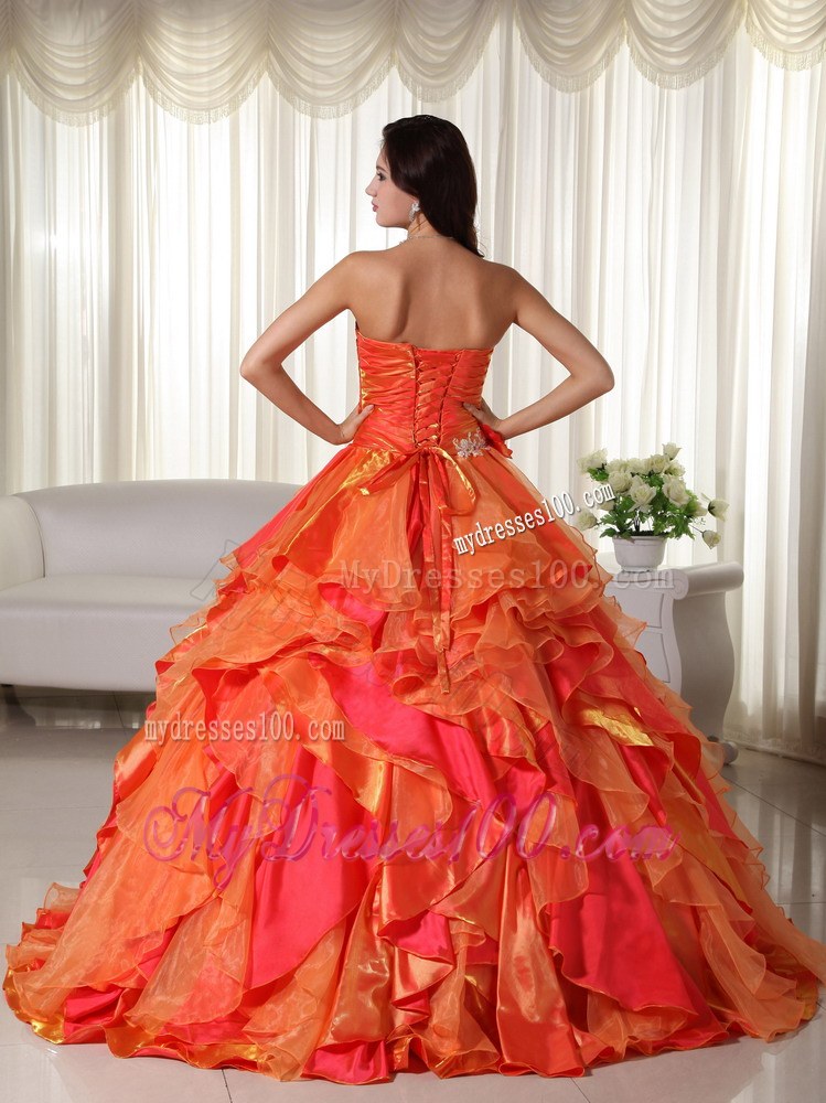 Ruched Orange Quinceanera Gown with Appliques and Ruffled Layers