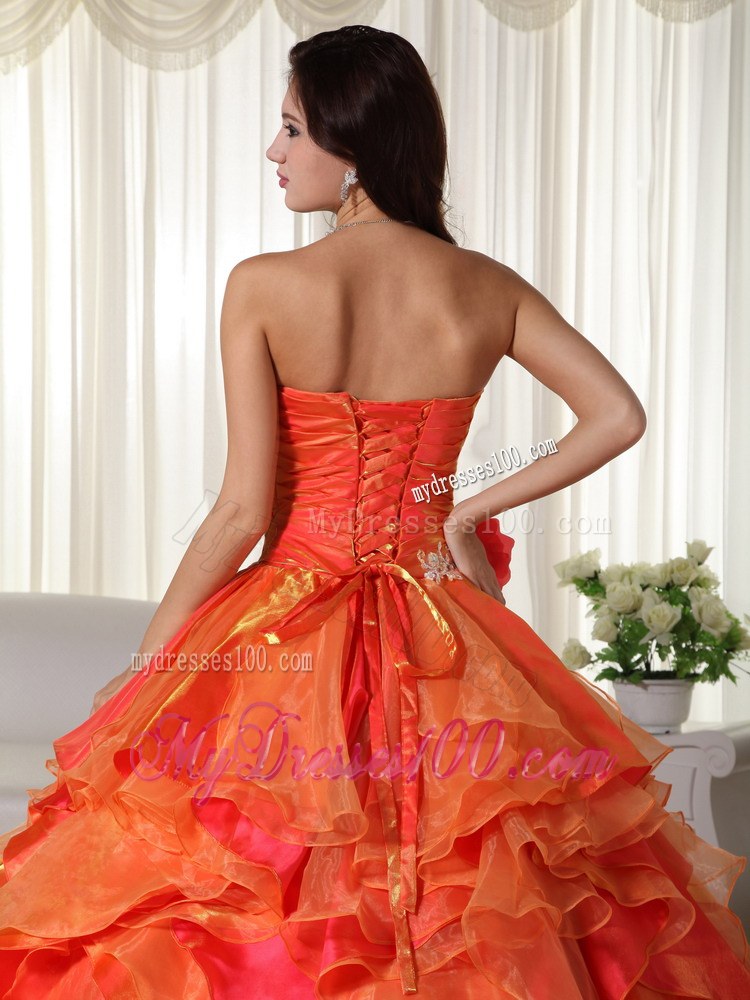 Ruched Orange Quinceanera Gown with Appliques and Ruffled Layers