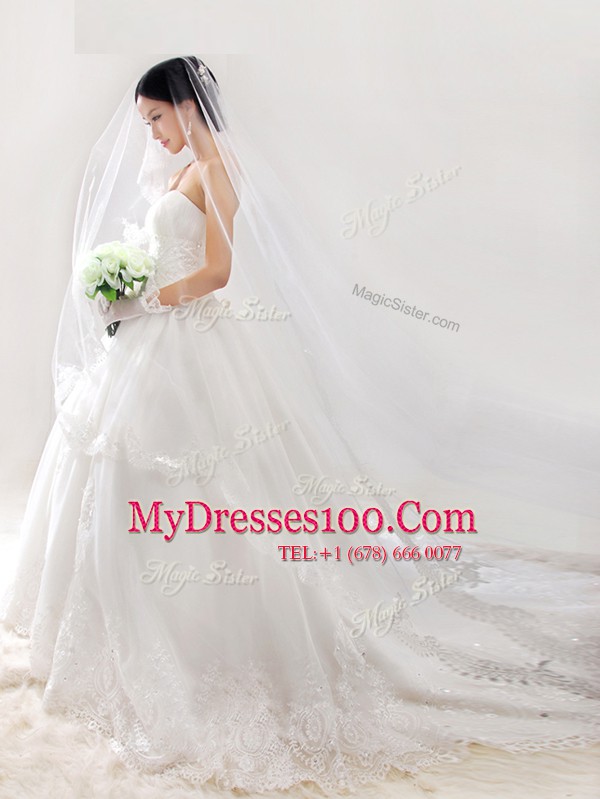 Fine Strapless Sleeveless Wedding Gown With Train Chapel Train Lace and Appliques White Organza
