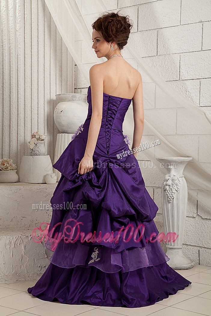 Appliques and Ruffled Layers Decorate on Purple Prom Gown