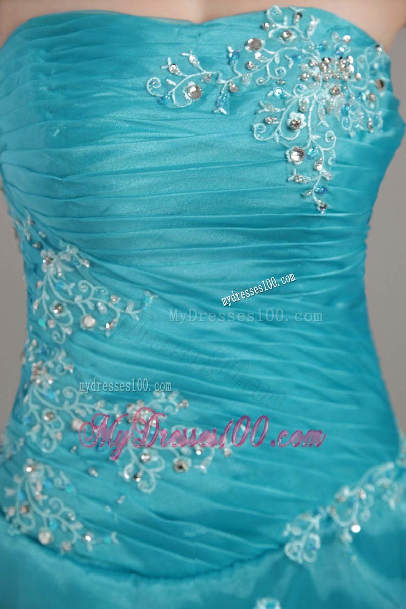 Turquoise Prom Gown with Pick-ups and Appliqued Hemline