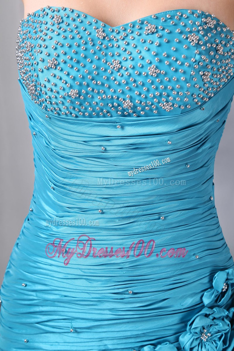Flowers and Pick-ups Decorate Prom Dresses in Turquoise
