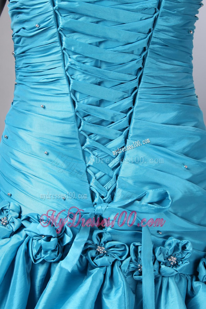 Flowers and Pick-ups Decorate Prom Dresses in Turquoise